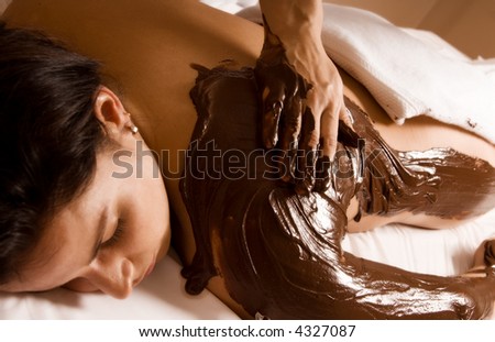young woman getting a chocolate massage at a spa Royalty-Free Stock Photo #4327087