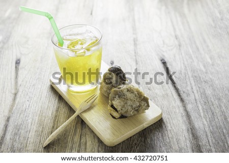 Rice dumplings or zongzi  with Ice Chrysanthemum tea on wood background