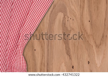 the checkered tablecloth on wooden table
