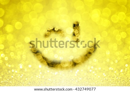 Abstract yellow emoji smiley face wink and glitter sparkle background