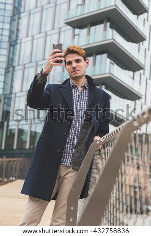 Young handsome man posing in an urban context