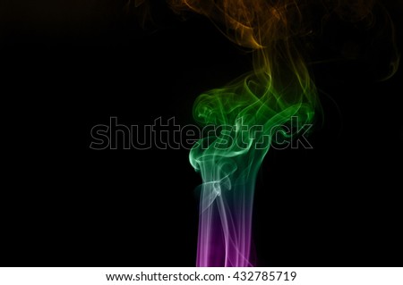Abstract colorful smoke on black background, smoke background,colorful ink background,Violet, Green, Orange,movement of smoke