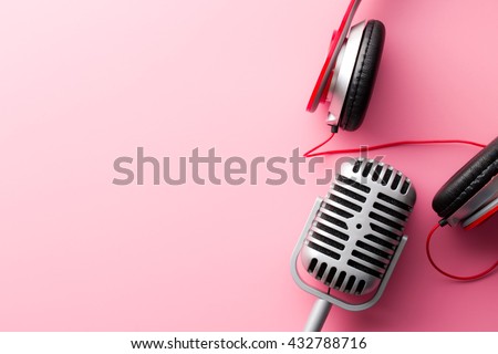 the vintage silver microphone and headphones Royalty-Free Stock Photo #432788716