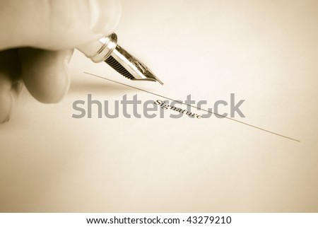 Sepia Toned image of Left Hand Signing Name with Fountain Pen