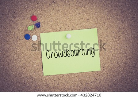 Crowdsourcing written on sticky note pinned on pinboard