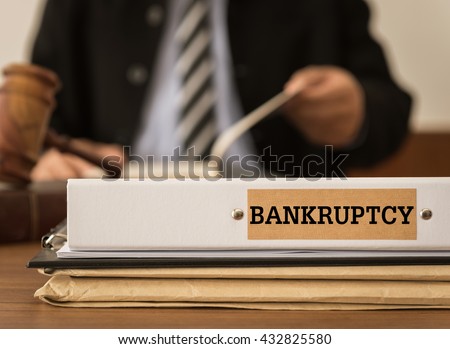 Bankruptcy document folder with lawyer work at law firm.
 Royalty-Free Stock Photo #432825580