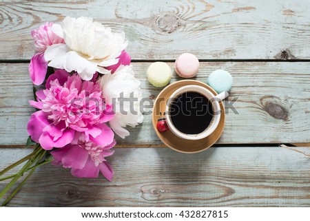 Cup coffee and flowers peonies