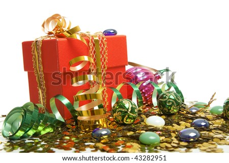 Red gift box on a white background with spangles and a streamer