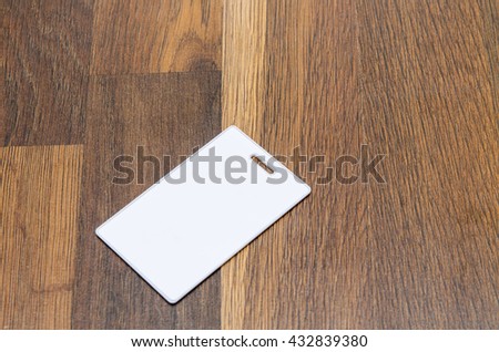 magnetic pass on the wooden background For graphic designers presentations and portfolios