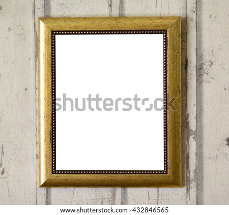 Empty photo frame hanging on wooden wall