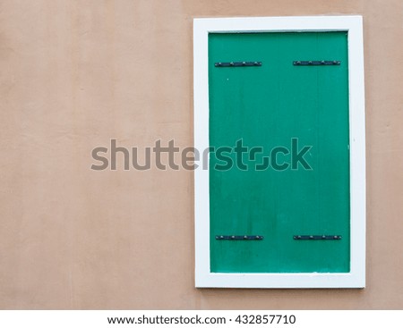 green window on brown background