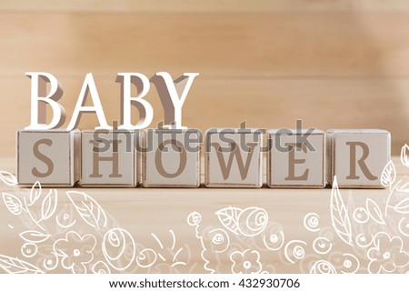 Educational cubes, on wooden background. Baby shower concept
