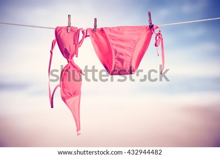pink wear of woman and beach 