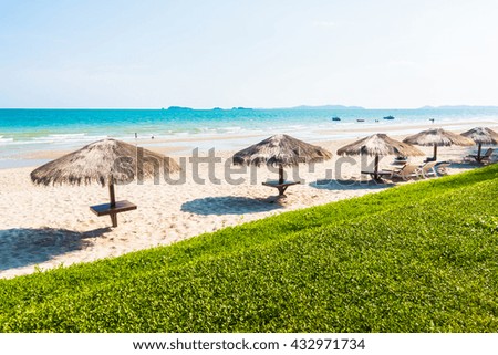 Umbrella on the beautiful tropical beach and sea with blue sky - Boost up color Processing - Holiday vacation concept for background