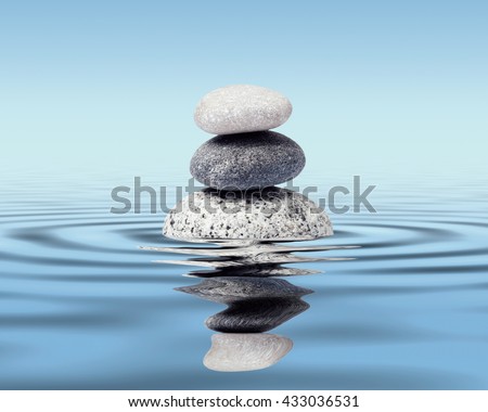 Zen stones in water with reflection - peace balance meditation relaxation concept Royalty-Free Stock Photo #433036531