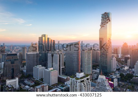 Aerial view of Bangkok modern office buildings, condominium in Bangkok city downtown with sunset sky , Bangkok , Thailand Royalty-Free Stock Photo #433037125