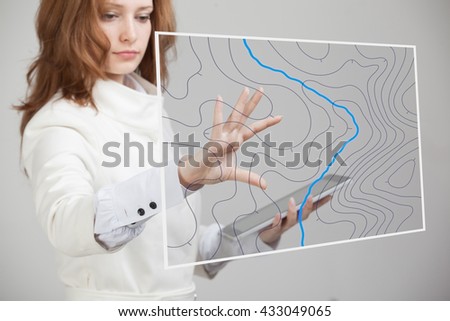 Geographic information systems concept, woman scientist working with futuristic GIS interface on a transparent screen. Royalty-Free Stock Photo #433049065