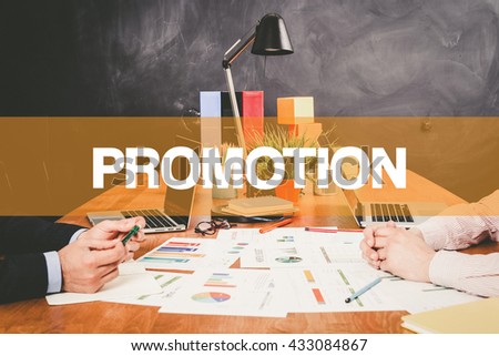 Two Businessman Promotion working in an office