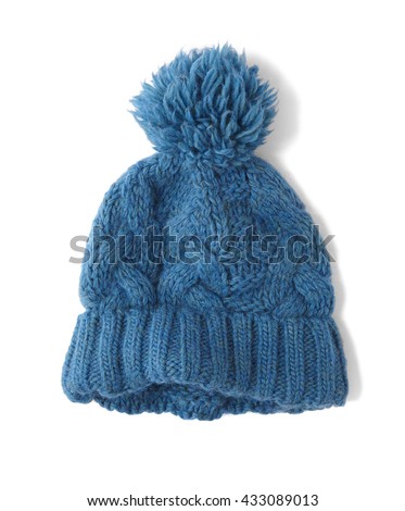A soft wool blue knitted bobble hat isolated on a white background Royalty-Free Stock Photo #433089013