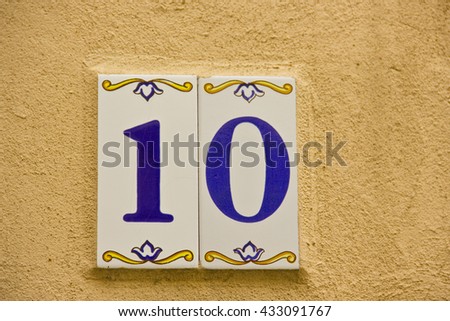 Number ten in a ceramic tile on street