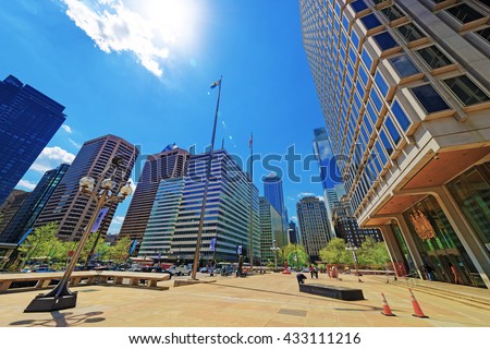 Municipal Services Building and Penn Center with skyscrapers in Philadelphia, Pennsylvania, USA. It is central business district in Philadelphia. Tourists in the street.