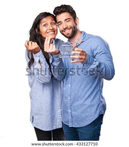 young couple holding a shopping cart