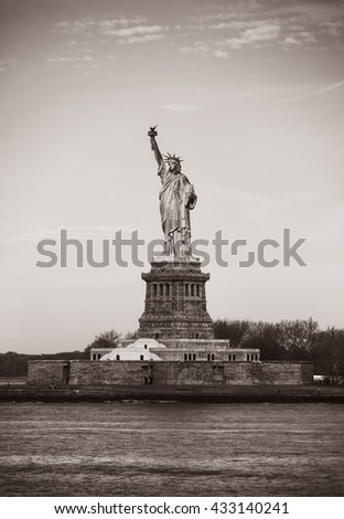 Statue of Liberty, New York City, USA. Old photo stylization, film grain added. Sepia toned