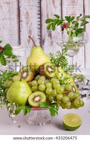 Fruit Centerpiece. Fruit Display is perfect for a party. Fresh Fruit Platter with Kiwi, Grapes and Pears.