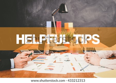 Two Businessman Helpful Tips working in an office