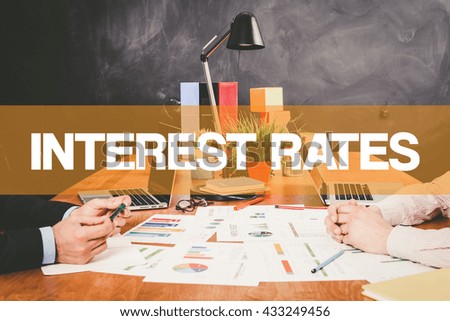 Two Businessman Interest Rates working in an office