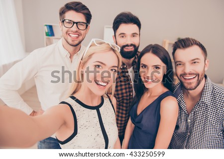 happy young successful group of businesspeople   make selfie photo and smiling
