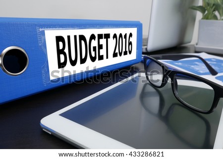 BUDGET 2016 Office folder on Desktop on table with Office Supplies. ipad