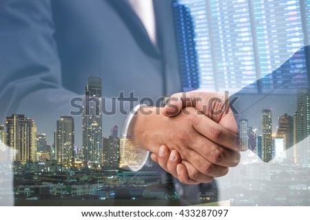 Double exposure of Business handshake ,Investment concept Royalty-Free Stock Photo #433287097