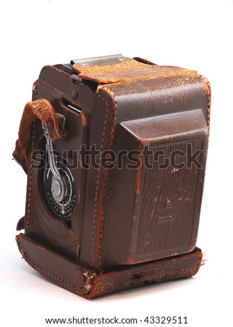 Closeup of an old medium format camera in a rustic leather case isolated on white background