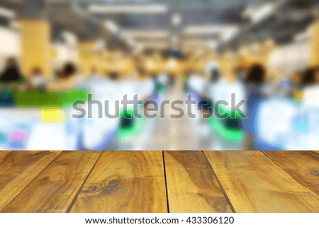 blurred wood table and people in the shopping mall