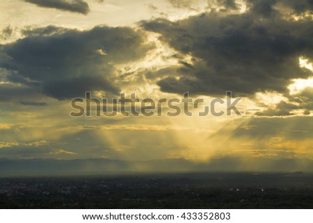 Clouds and Rainy Stormy Night with sun rays 
