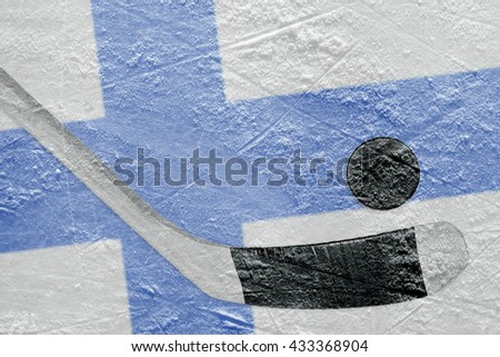 Image Finnish flag and hockey puck with the stick on the ice. Concept