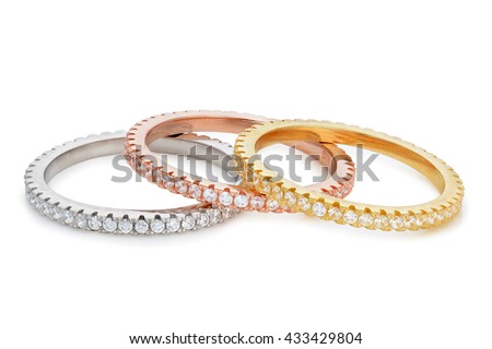 Three rings made of different shades of gold with diamonds around the entire circumference.