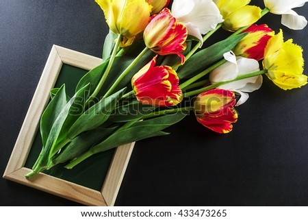 Composition of the bouquet of tulips in a frame