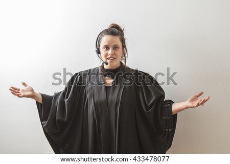 thirty something brunette woman dress as a preacher with her arm opened