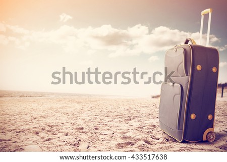 vintage photo of gray suitcase 