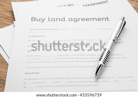 Table top view business finance background concept.Flat lay variety objects and land contract form on modern rustic brown wood at home office desk studio.space for creative design content & font. 