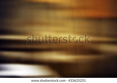 Light brown shaped de focused background
A picture obtained moving the camera while shooting
