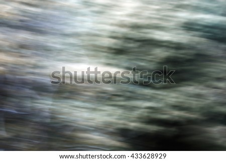 Gray shaped de focused background. A picture obtained moving the camera while shooting

