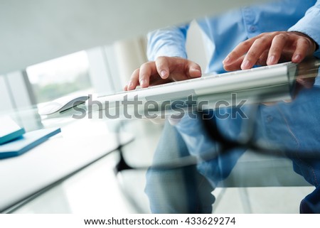 Cropped image of business person typing on keyboard