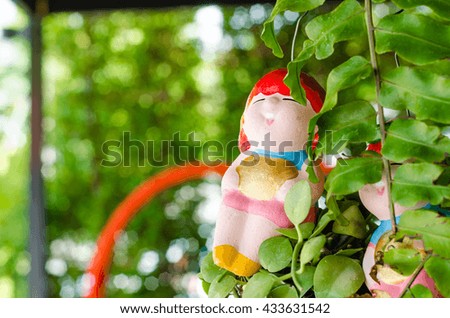 Clay Doll smile, green background