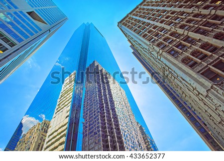 Bottom-up view of skyscrapers reflected in glass in Philadelphia, Pennsylvania, USA. It is central business district in Philadelphia