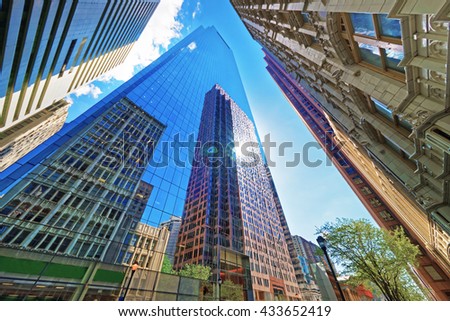 Bottom up view on skyscrapers reflected in glass in Philadelphia, Pennsylvania, USA. It is central business district in Philadelphia