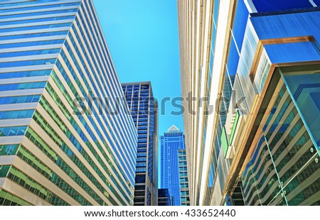 Bottom up view of skyscrapers reflected in glass in Philadelphia, Pennsylvania, USA. It is central business district in Philadelphia