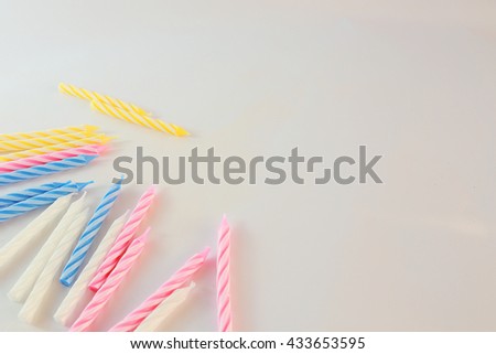Background picture of  Variety of birthday candles in a row. Copy space.